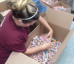 Alyssa getting TONS of candy ready to toss out  in local parades in the summer.